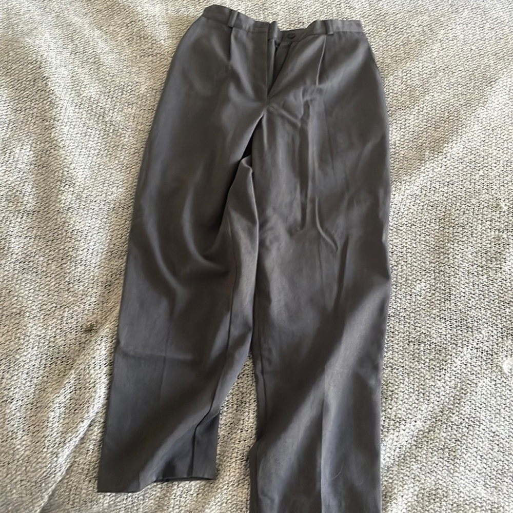 Waist is 13in laid flat. Rise is also 13in. Polyester/Rayon blend trousers.